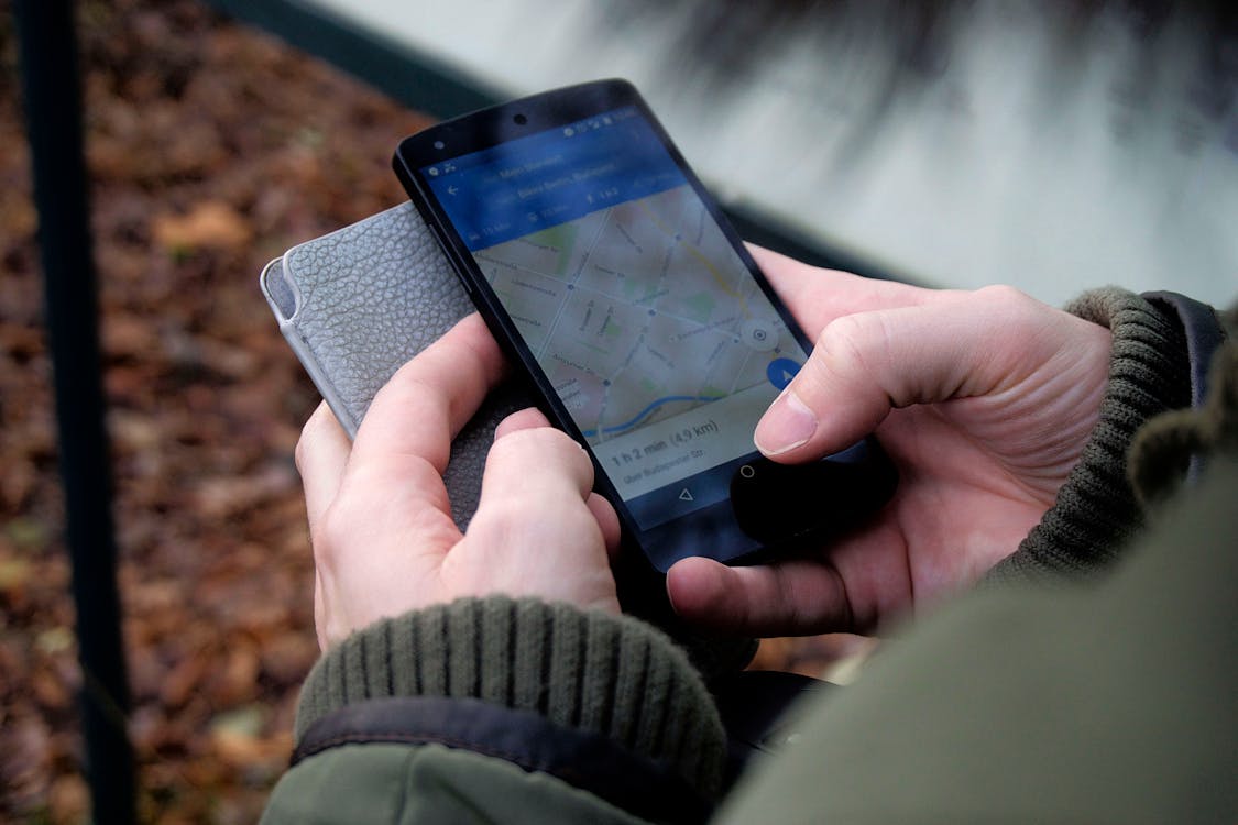 Using a map app on a smartphone outdoors to locate a lost iPhone via GPS