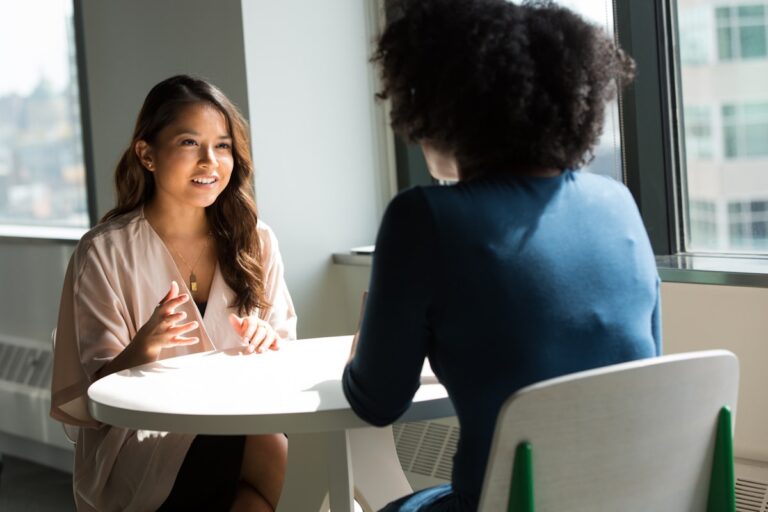 A person talking to a therapist in a comfortable counseling session