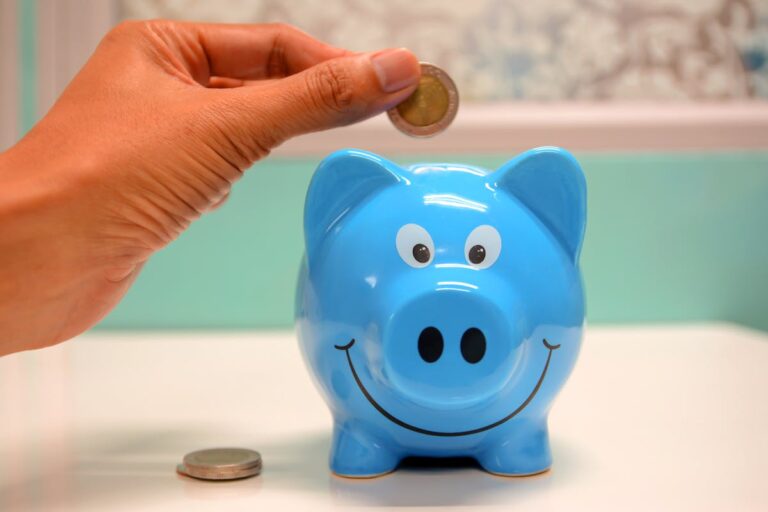 Person saving coins in a piggy bank - how to find unclaimed money