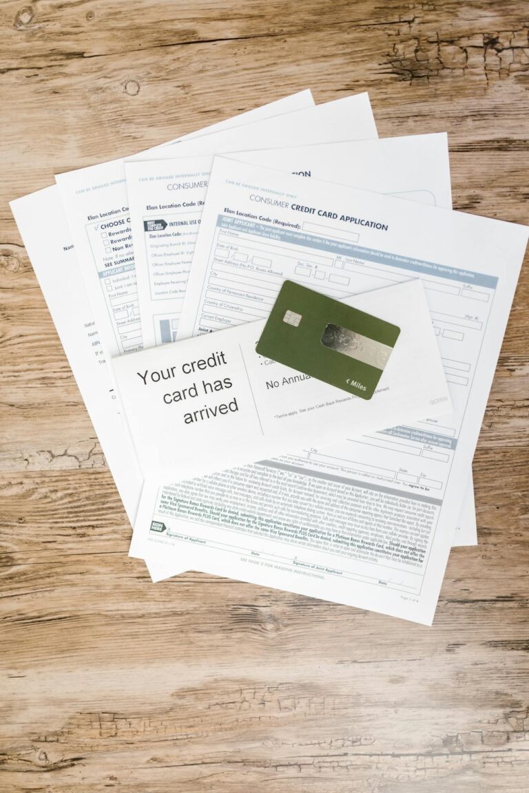 Credit application forms and a credit card on a wooden table