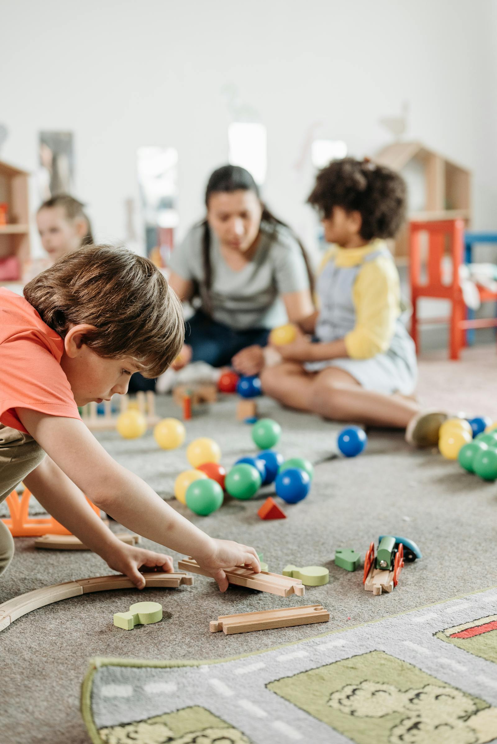 Children interacting with toys in a vibrant kindergarten classroom