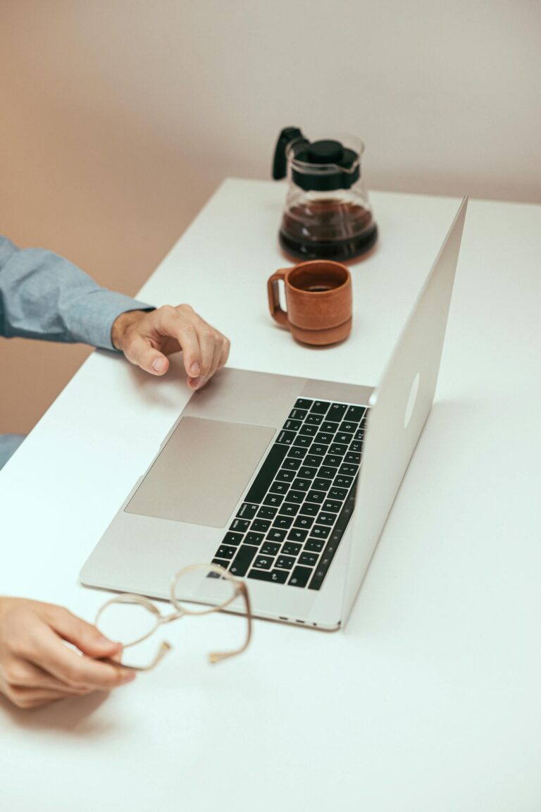 College student researching how to find an internship on a laptop