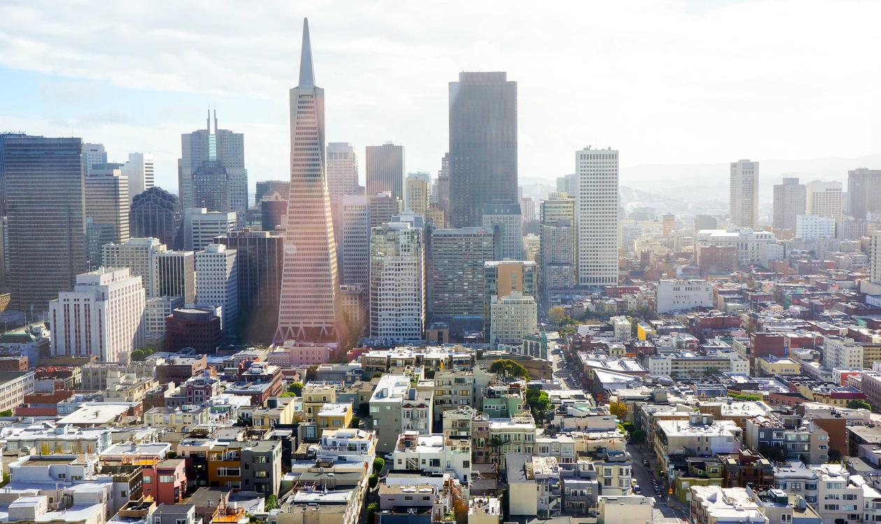 A personal trainer working with a client at the gym
