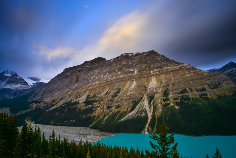 Person measuring wall stud spacing with a tape measure