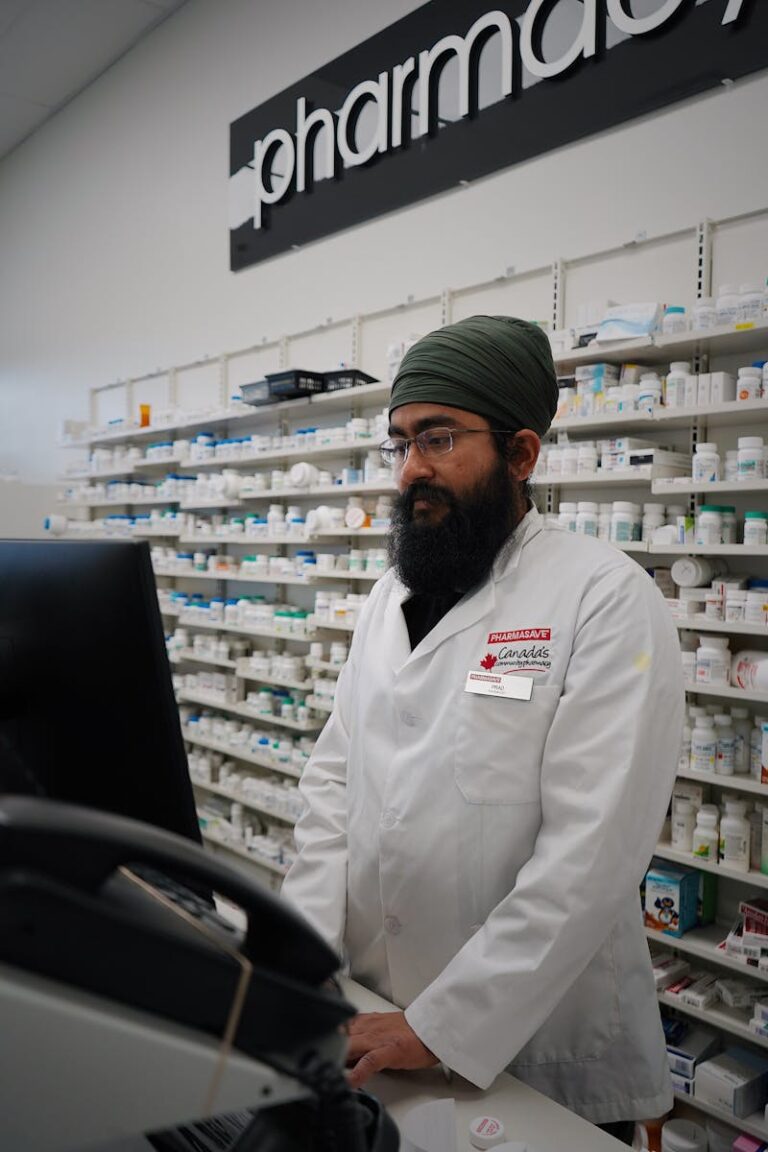 Pharmacist helping a patient compare prescription drug prices