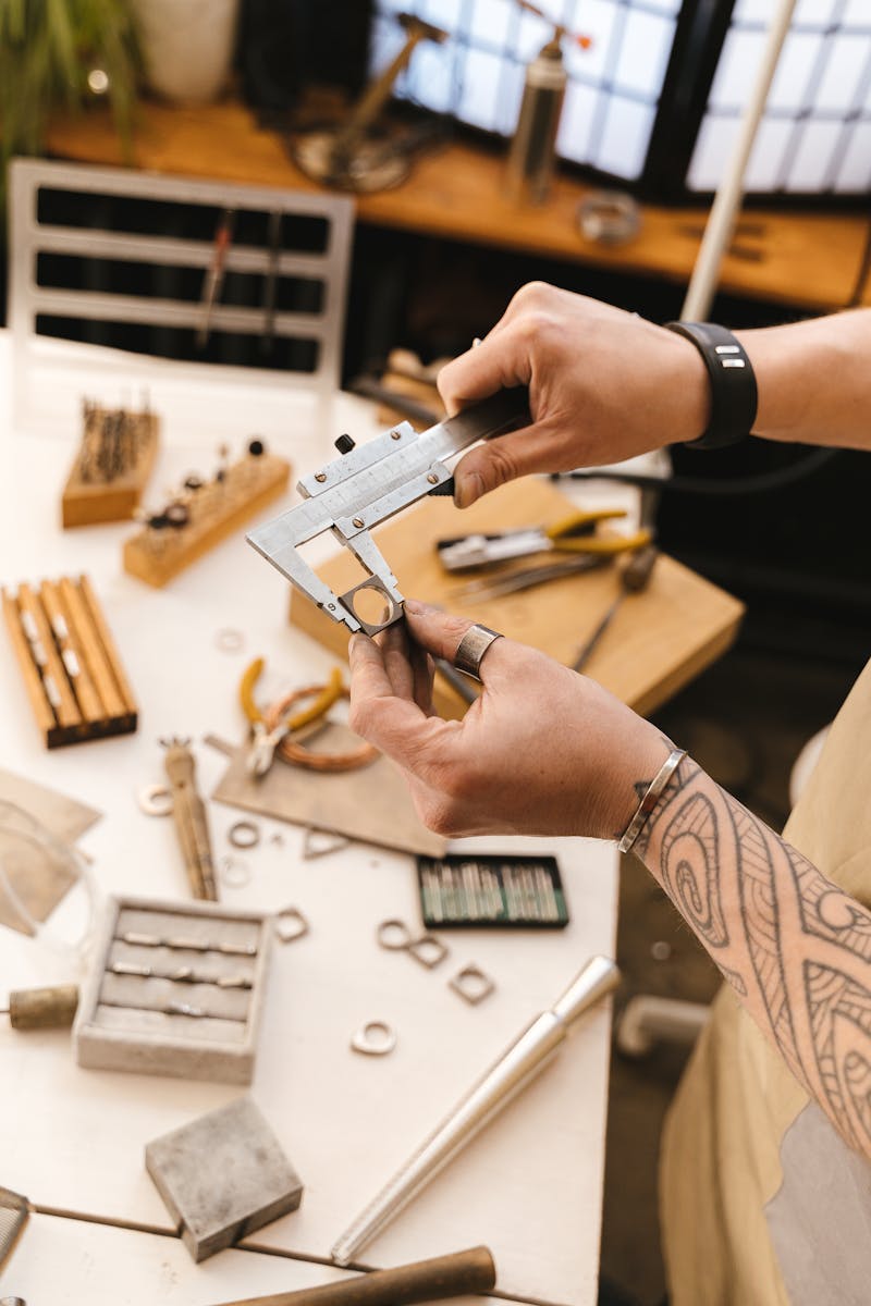 Close-up of a ring measurement tool being used to find ring size