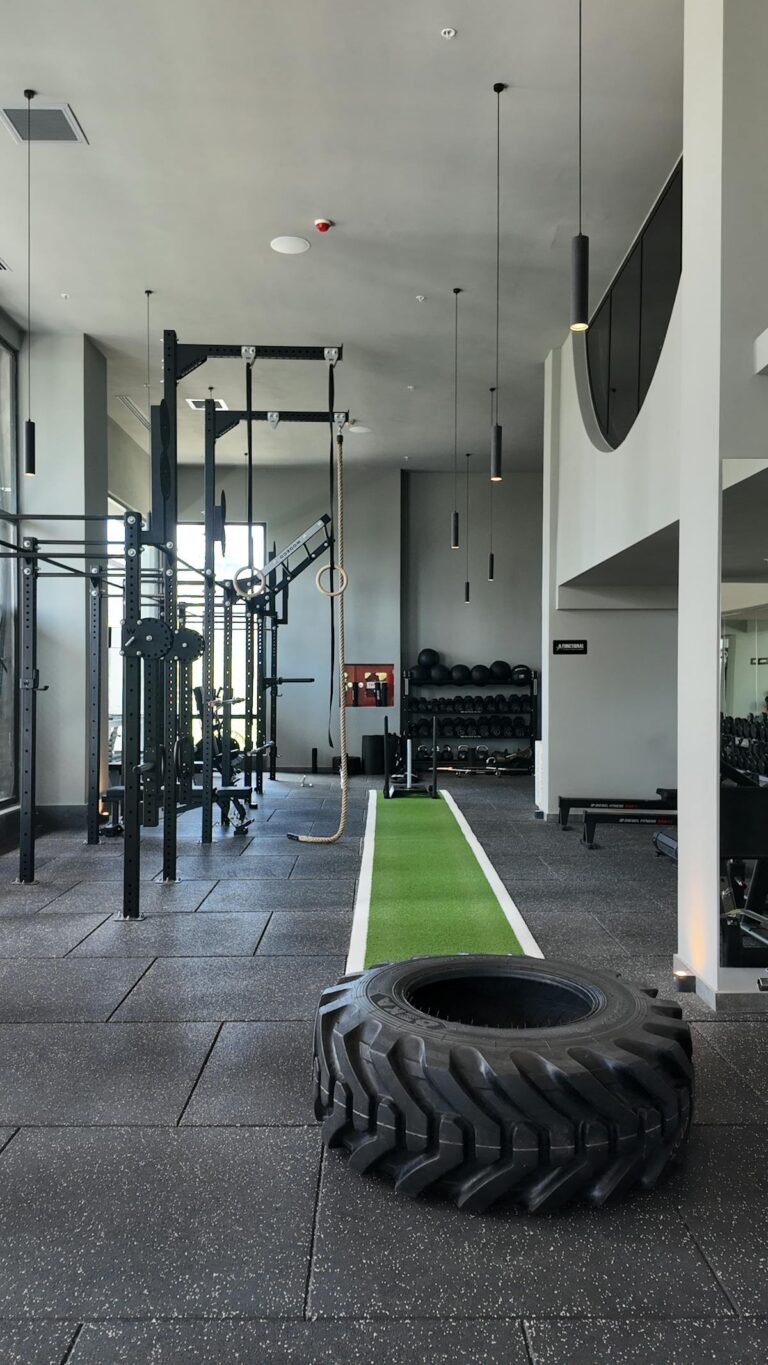 Spacious modern gym filled with cardio and strength equipment